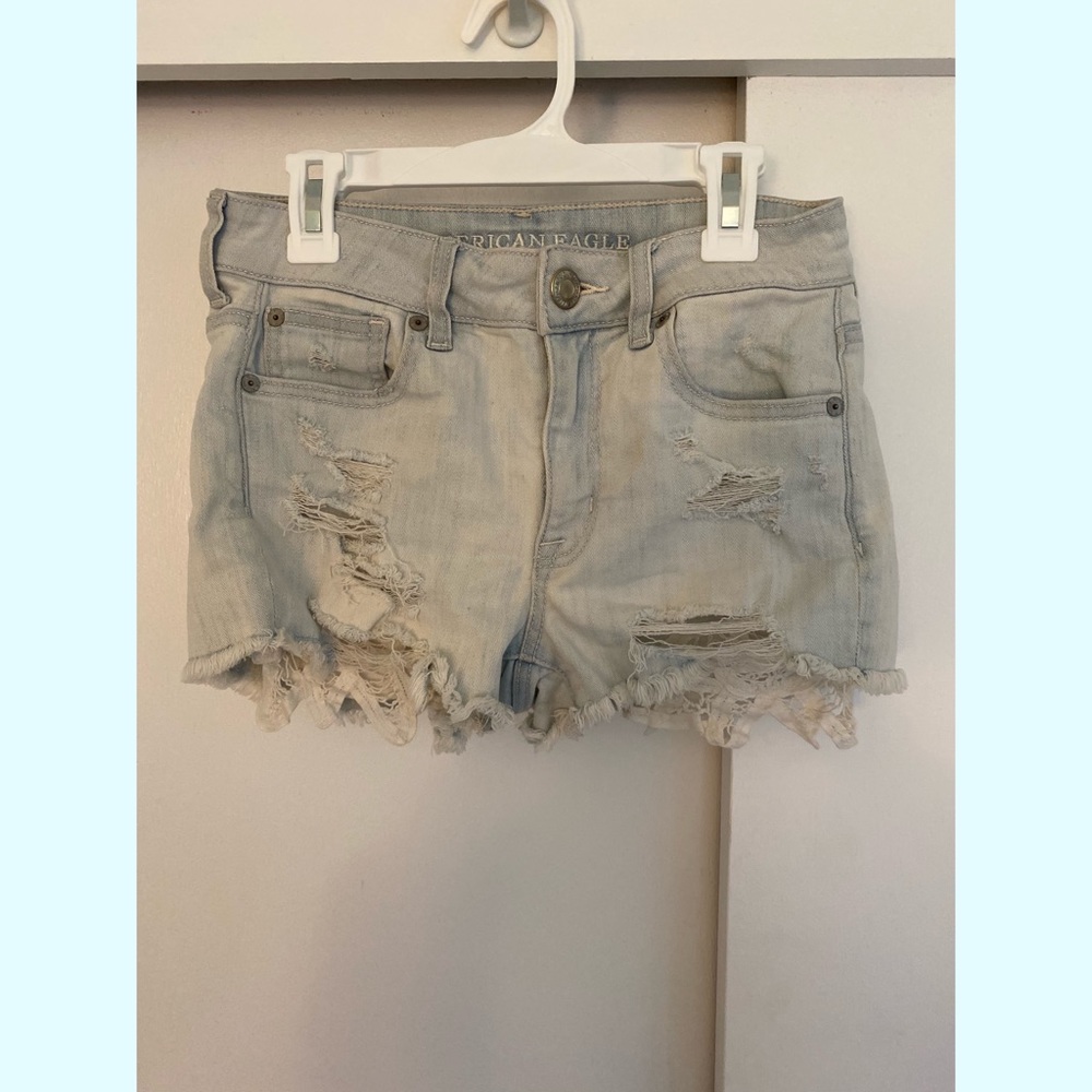 light wash denim shorts with crochet pockets